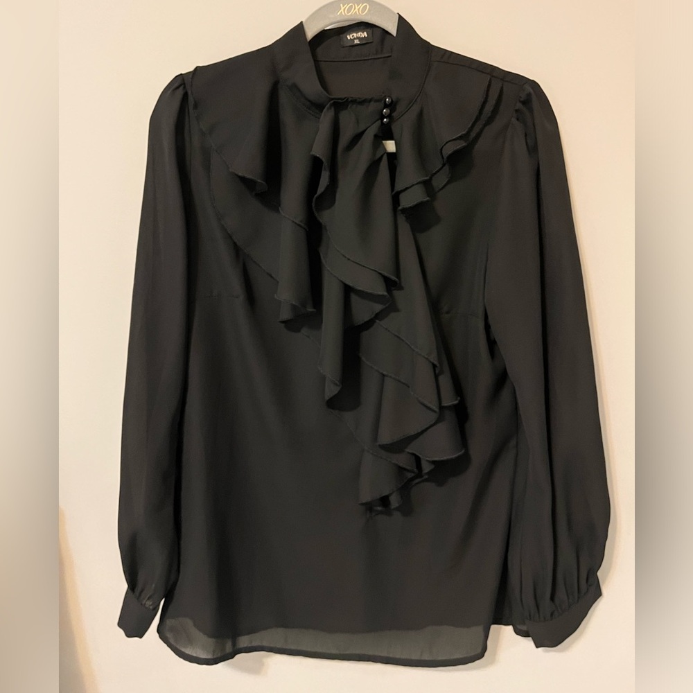 Black chiffon long sleeve top. Size XL but feels large.